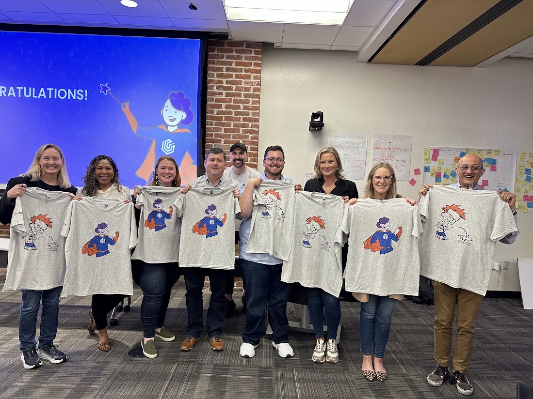 CCO Club members holding up t-shirts after a workshop