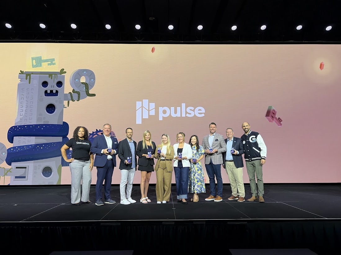 Josh with the Gamechanger Award winners on the Pulse stage