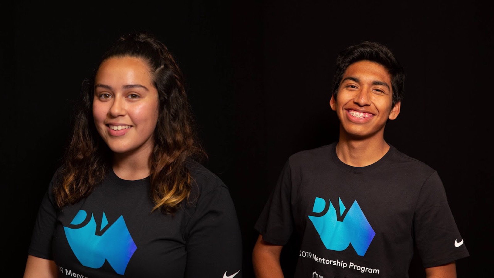 Two students in 2019 Mentorship Program t-shirts smiling